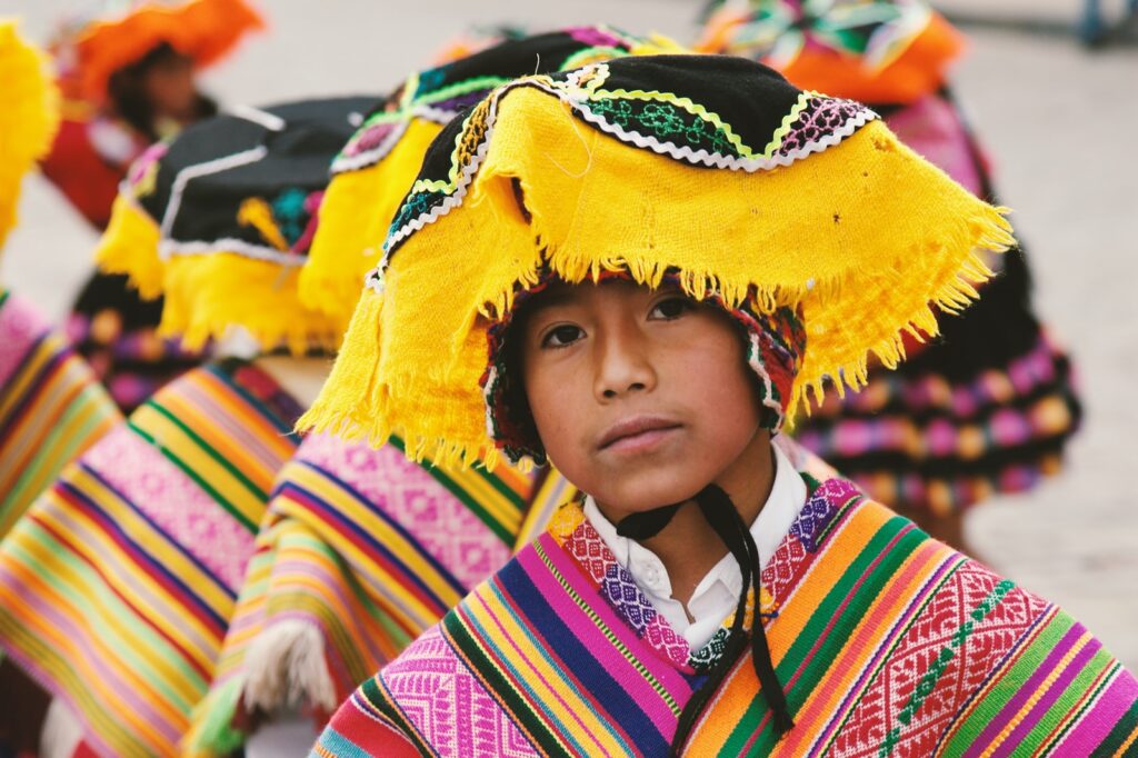 boy in traditional costume in shallow focus photography