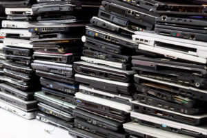 Stack of old, broken and obsolete laptop computer